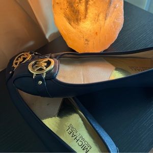 Michael Kors flats. Worn. Good condition.
